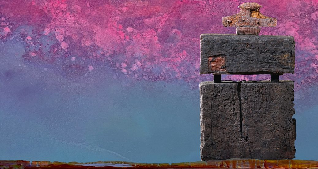 Ein Objekt aus Holz vor einer gemalten Landschaft